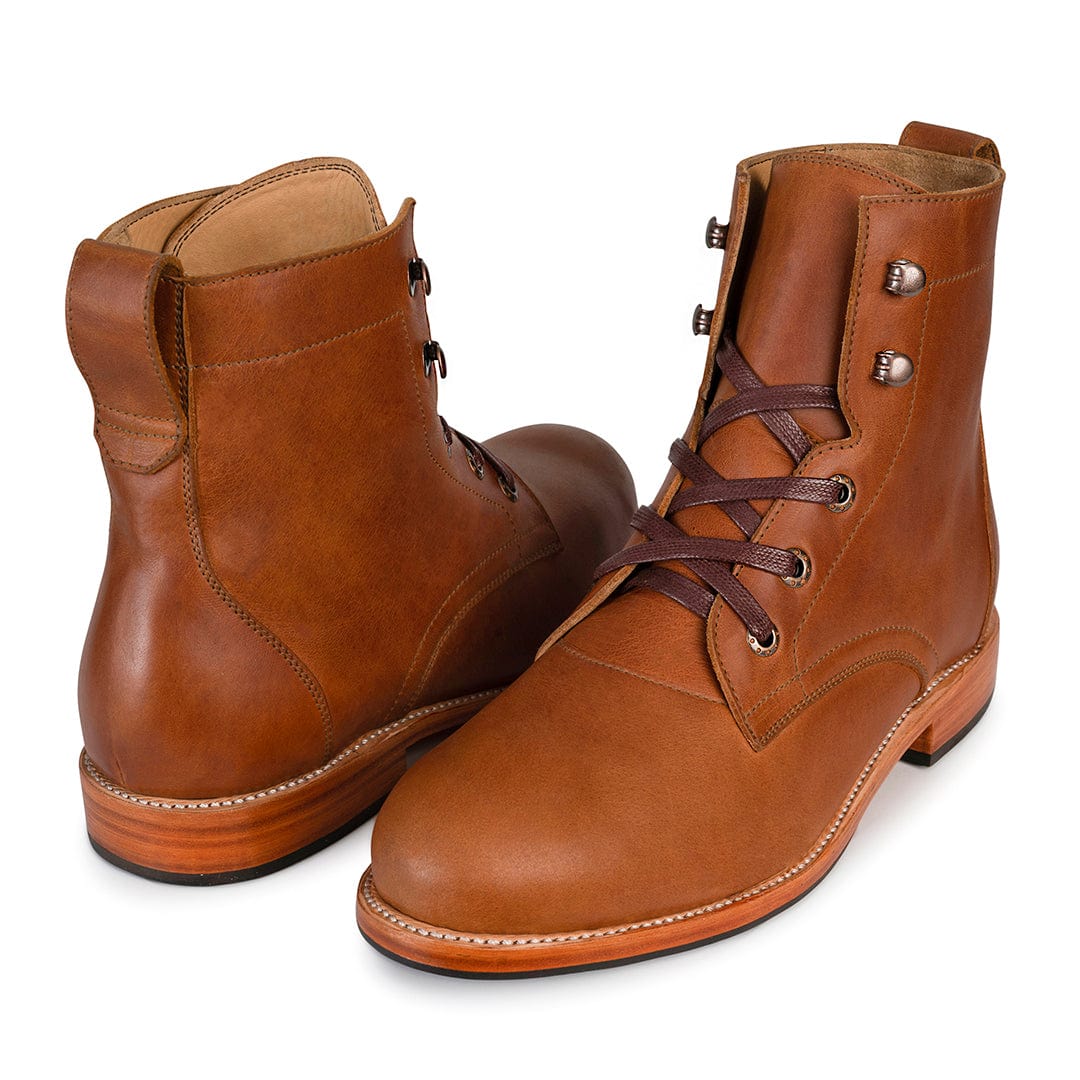 Handcrafted brown full grain leather men's lace up boots with Goodyear welt construction and a rugged polished finish