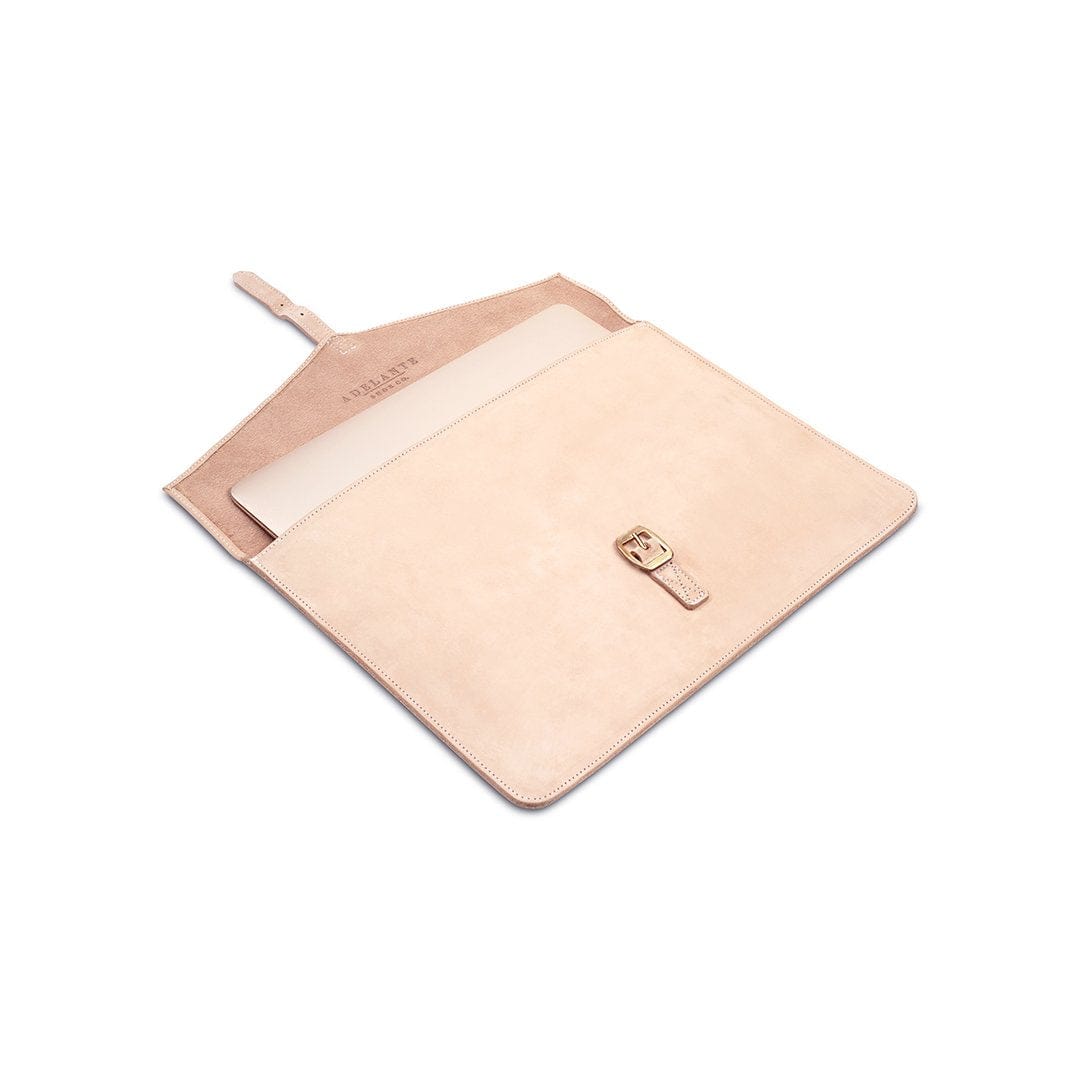Cream leather laptop sleeve with buckle strap, shown open, made to order in Guatemala