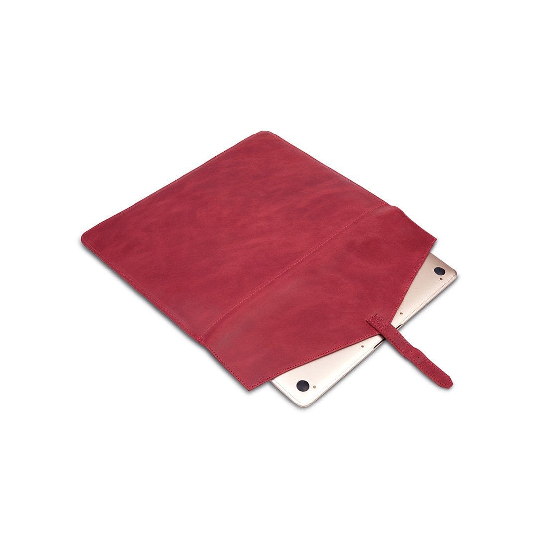 Red leather laptop sleeve with buckle strap, shown open, handcrafted to order in Guatemala