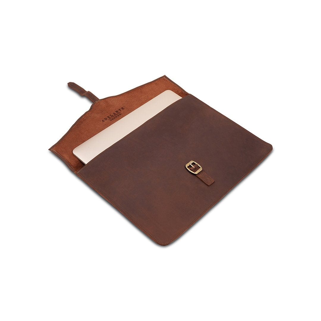 Brown leather laptop sleeve with buckle strap, shown open, made to order