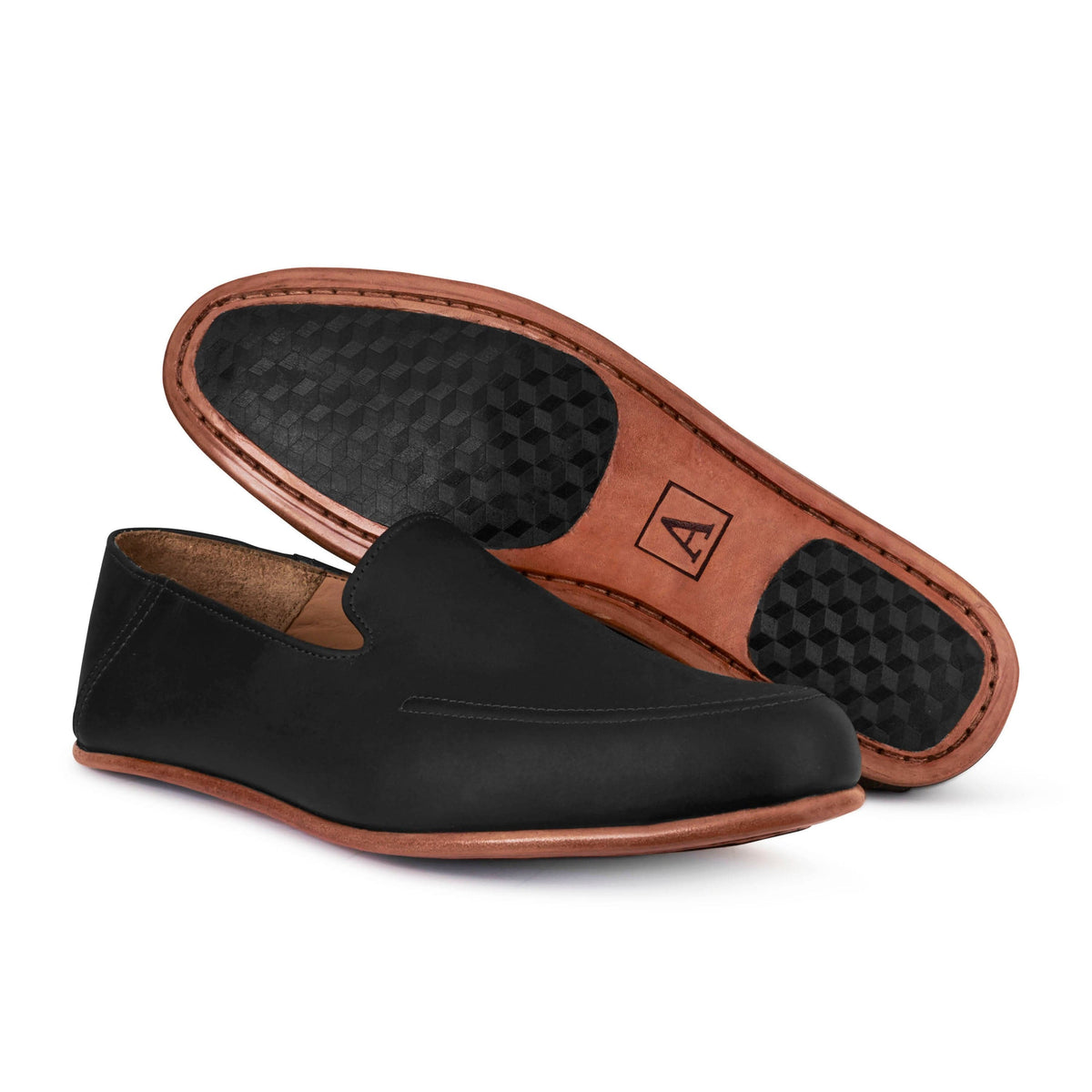 Men's extra-wide black leather zero-drop loafers, showing the leather sole – The Tomás