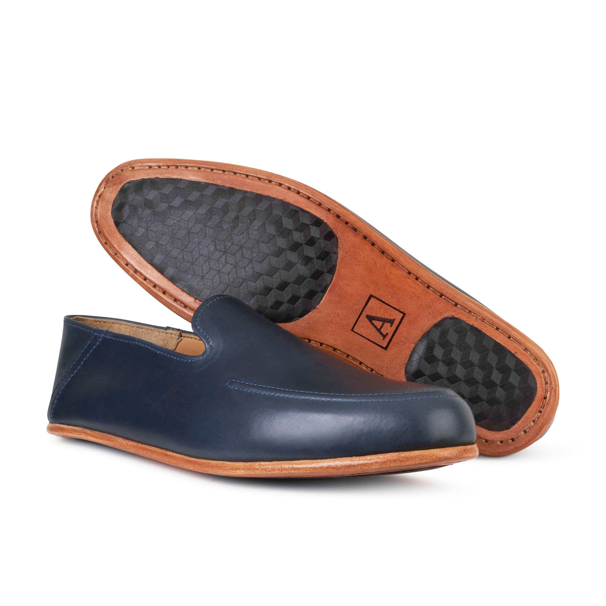 Men's extra-wide blue leather zero-drop loafers, showing the leather sole. Handcrafted to order in Guatemala