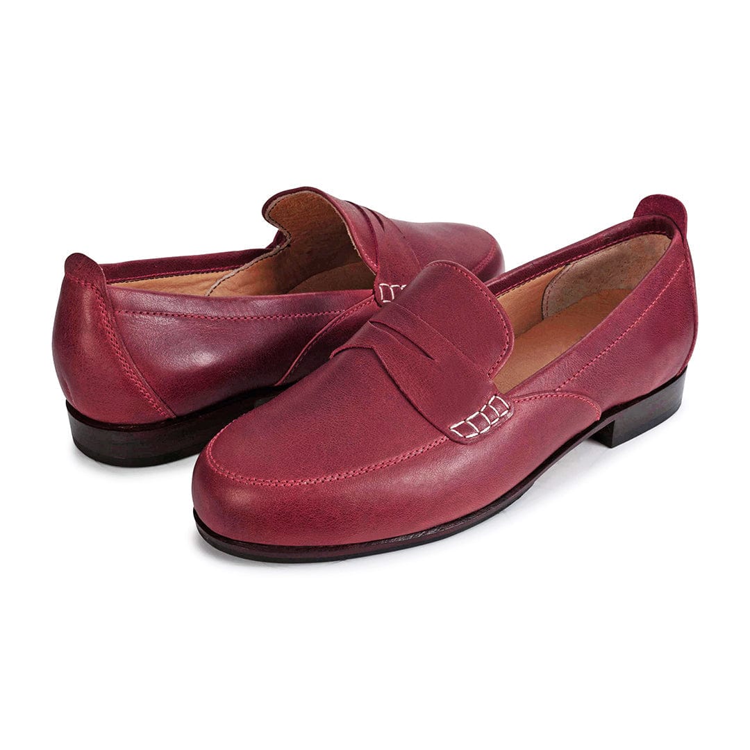 Pair of women's EEE wide red leather dress loafers, shown from the front at an angle – The Sabina