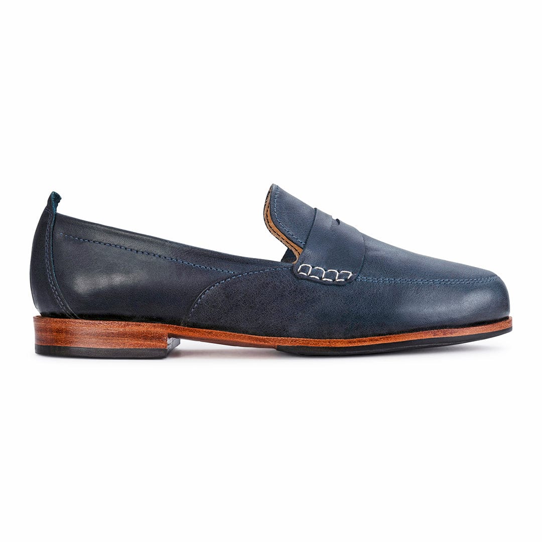 Women's narrow A-width blue leather dress loafer, seen from the side. Crafted for wide and narrow feet – The Sabina