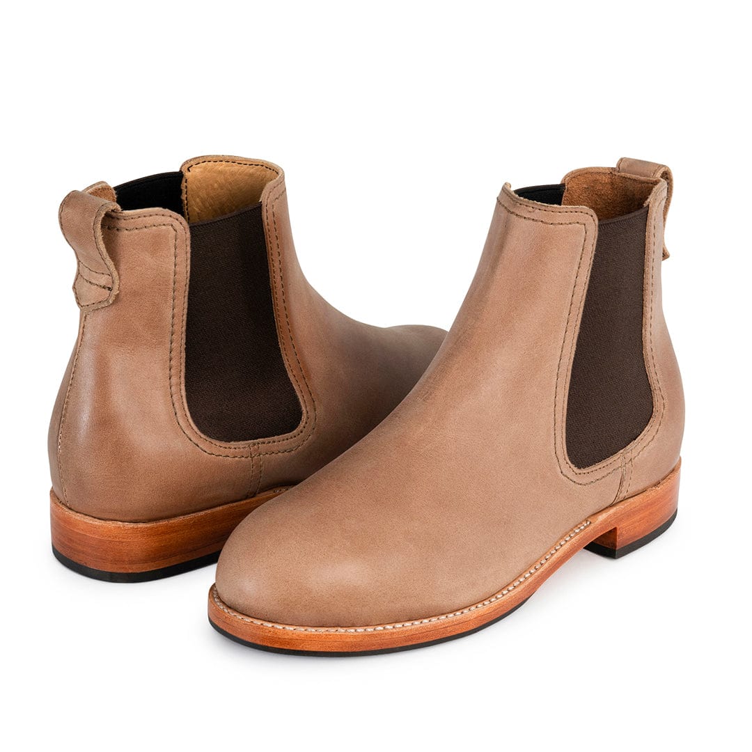 Tan leather women's Chelsea boots with elastic side panels, pull tabs, contrast stitching, and low walking heels, available in wide widths