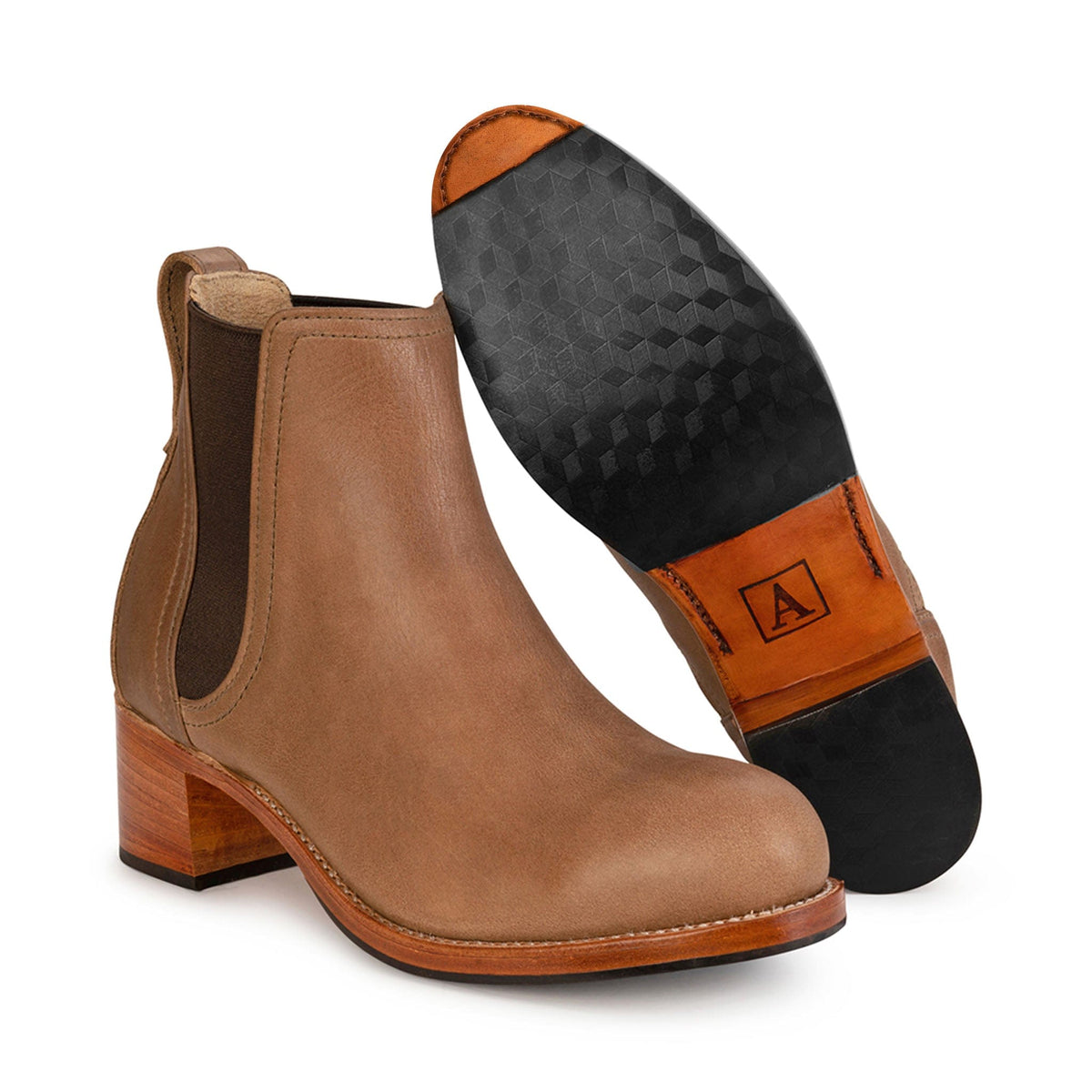 Women's 2E-wide tan leather heeled Chelsea boot, showing the leather sole, made by hand in Guatemala – The Catalina