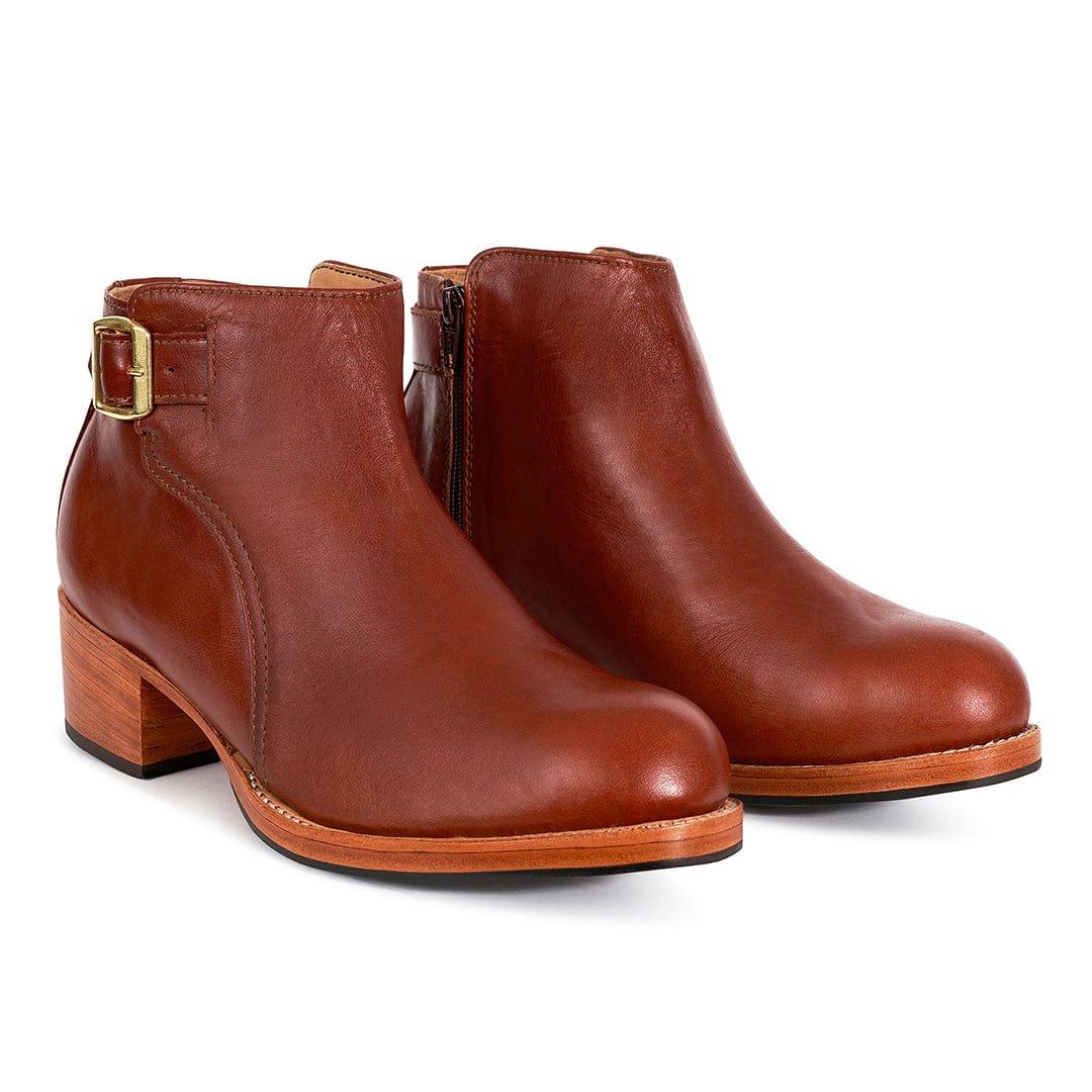 Brown leather women's buckle booties with block heels and side zippers, handcrafted by Adelante Shoes and available in wide widths