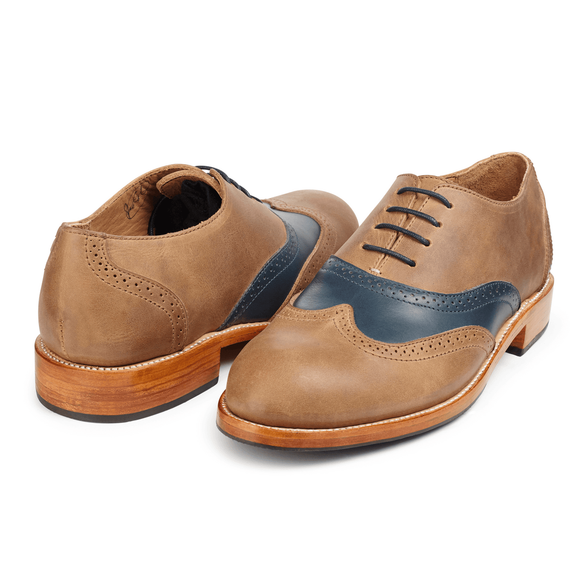 Pair of men's 4E-wide tan and blue leather oxfords, shown from the front at an angle, made by hand in Guatemala – The Clásico