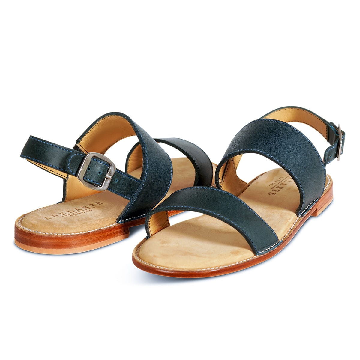 Pair of women's wide blue leather sandals, shown from the front at an angle, made by hand in Guatemala – The Córdoba