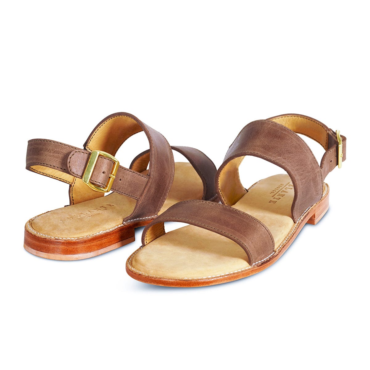 Women's EEE wide taupe leather sandals, shown at an angle, can be made in size 9.5 – The Córdoba