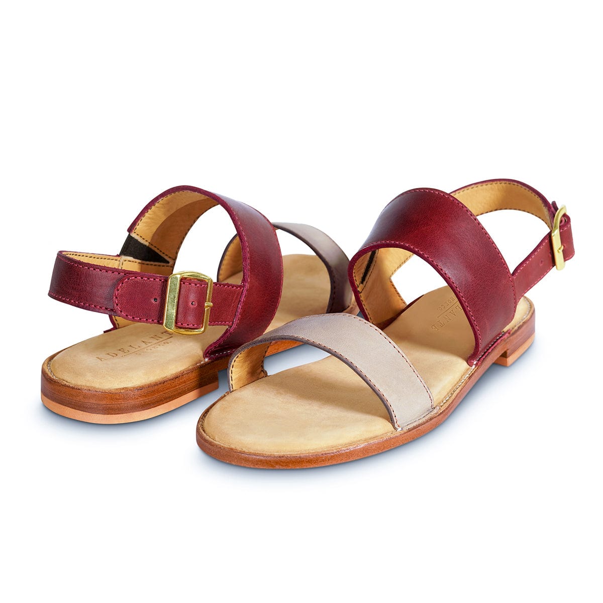 Pair of women's 2E-wide red and cream leather sandals, shown from the front at an angle, made to order for hard-to-fit feet