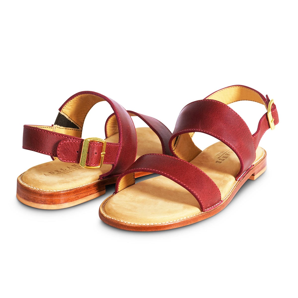Women's 3E-wide red leather sandals, shown from the front at an angle. Available in every half size – The Córdoba