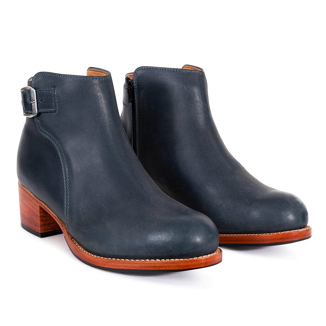 Navy women's buckle booties with adjustable ankle straps, rounded toes, and wood effect block heels