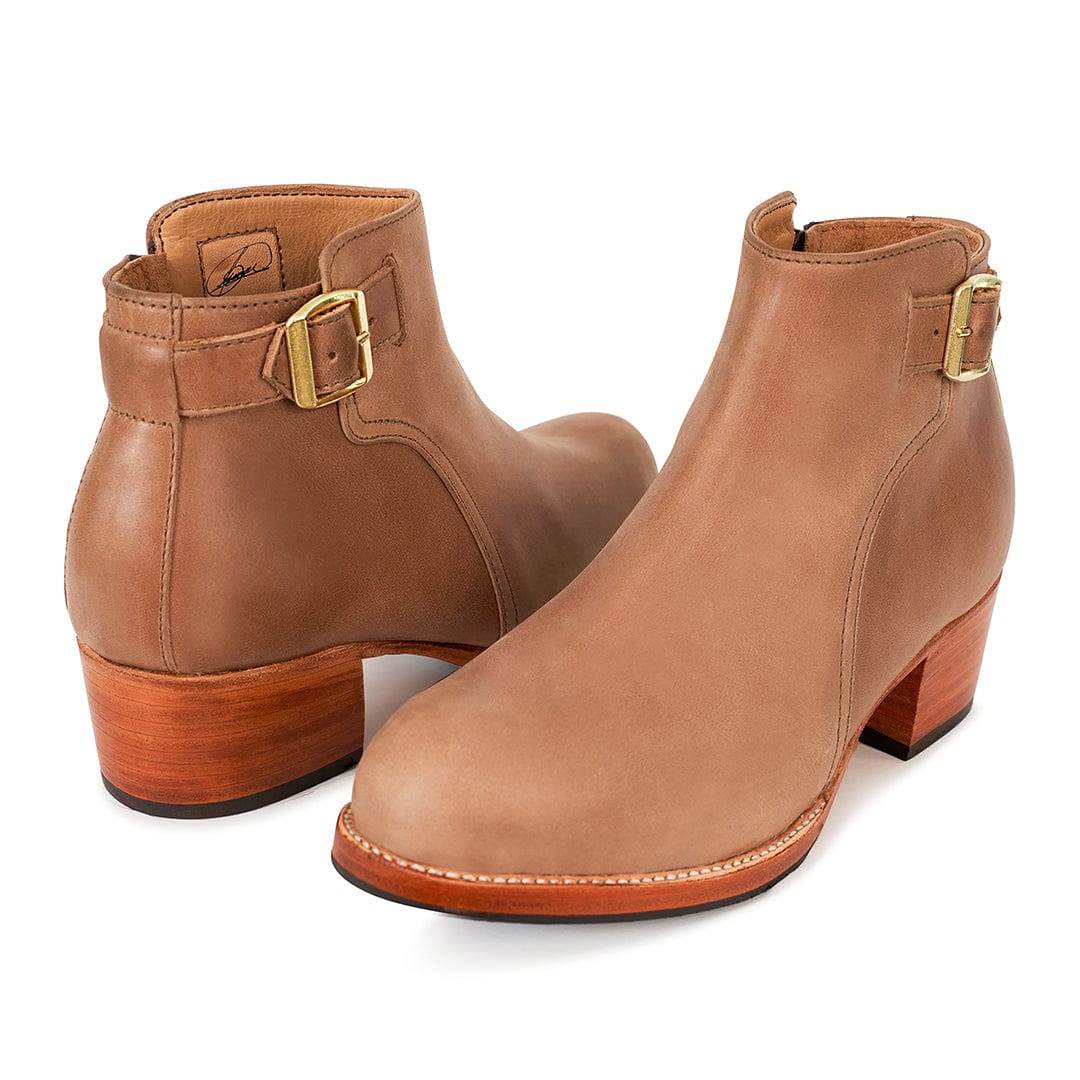 Brown leather women's buckle booties with block heels and adjustable straps, handcrafted in Guatemala and available in size 4 to 15 and wide widths