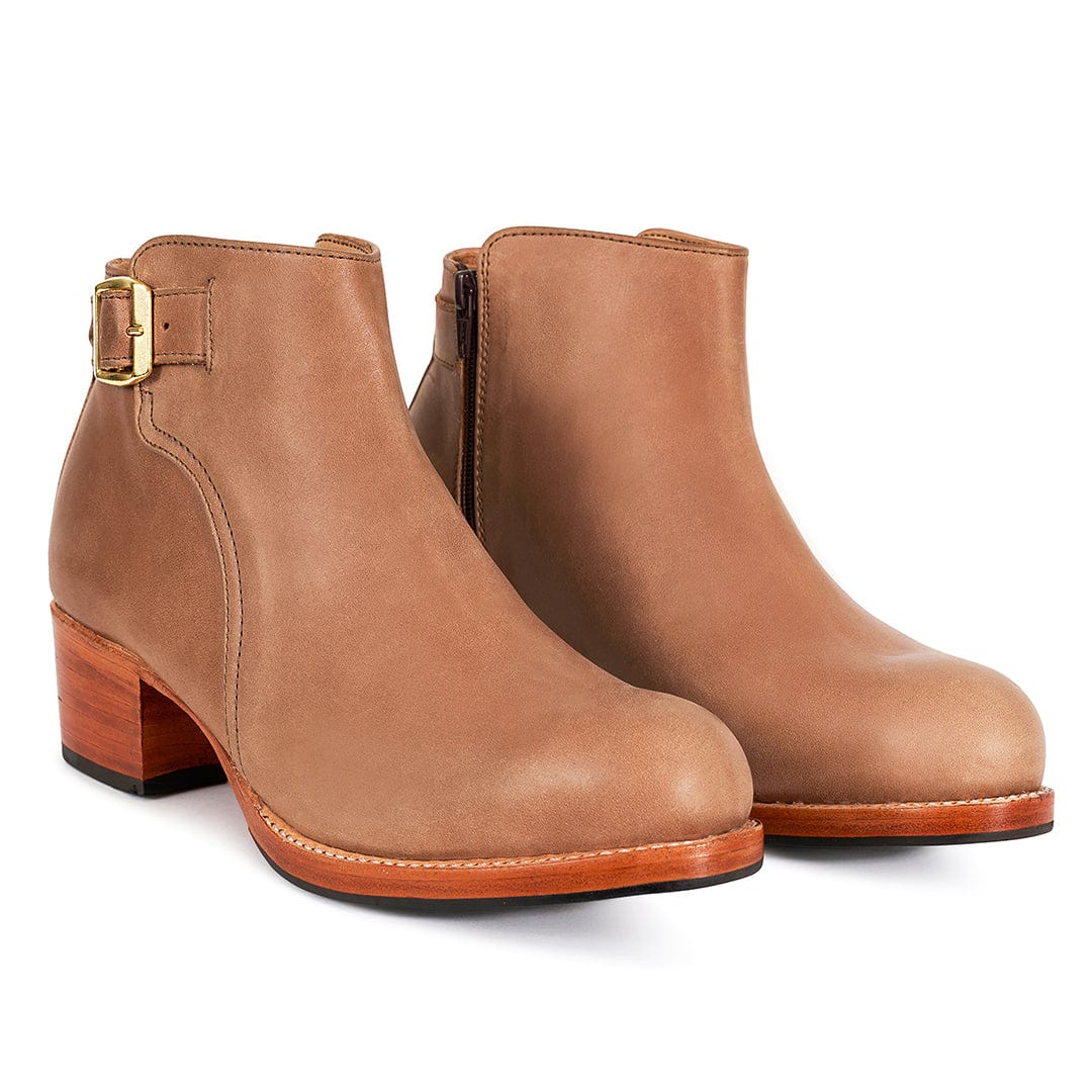 Tan women's buckle booties with block heels, side zippers, and adjustable straps from Adelante Shoes, available in wide widths