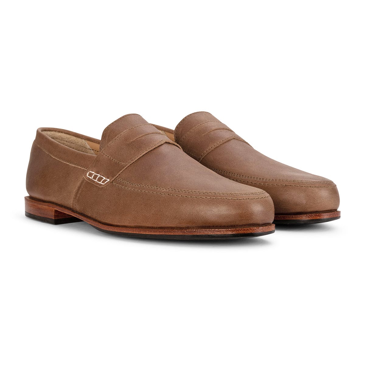 Brown men's leather dress loafers with vamp straps, sleek stitching, and stacked heels, handcrafted in Guatemala by Adelante.