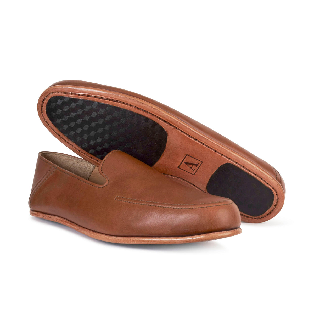 Men's extra-wide light brown leather zero-drop loafers, shown with the sole turned up – The Tomás