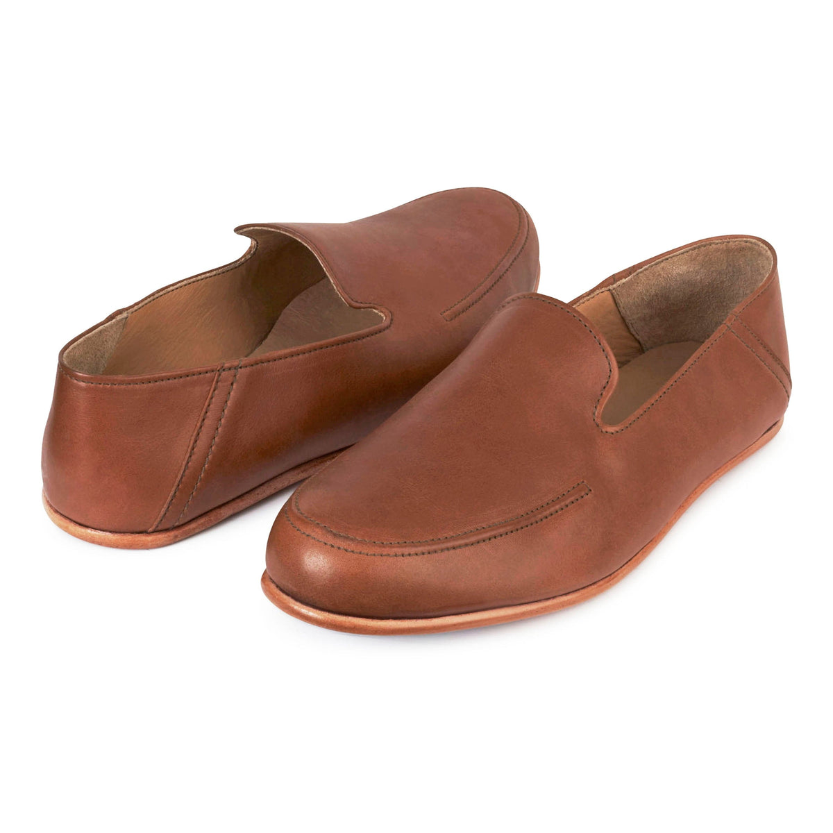 Pair of men's EEE wide light brown leather zero-drop loafers, shown from the front at an angle – The Tomás