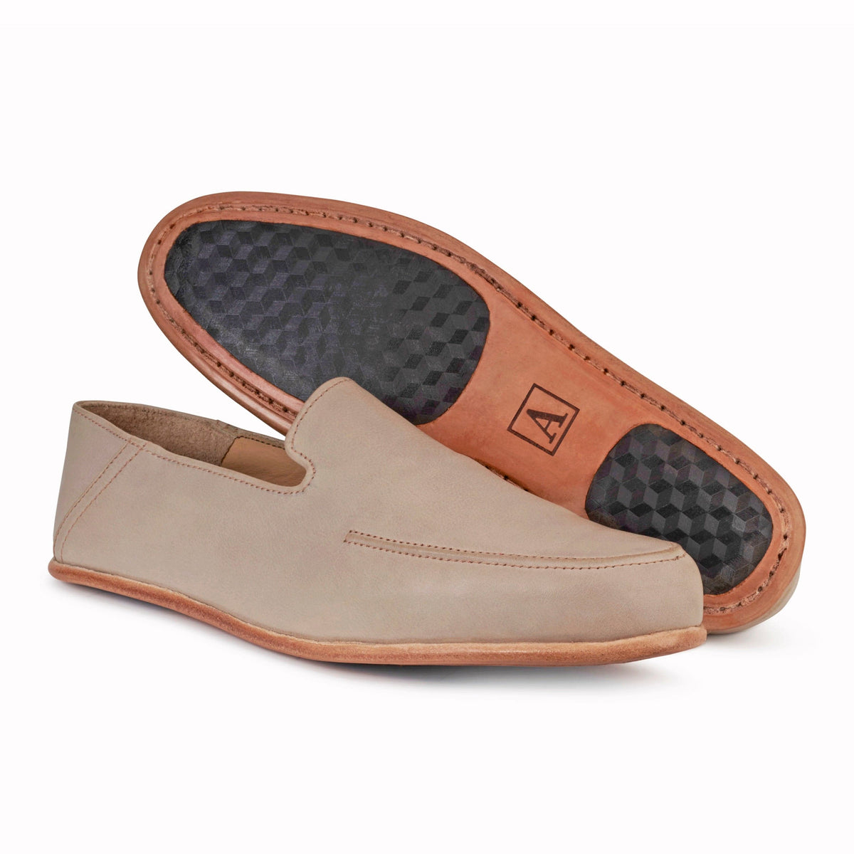 Men's wide cream leather zero-drop loafers, showing the leather sole, made by hand in Guatemala – The Tomás