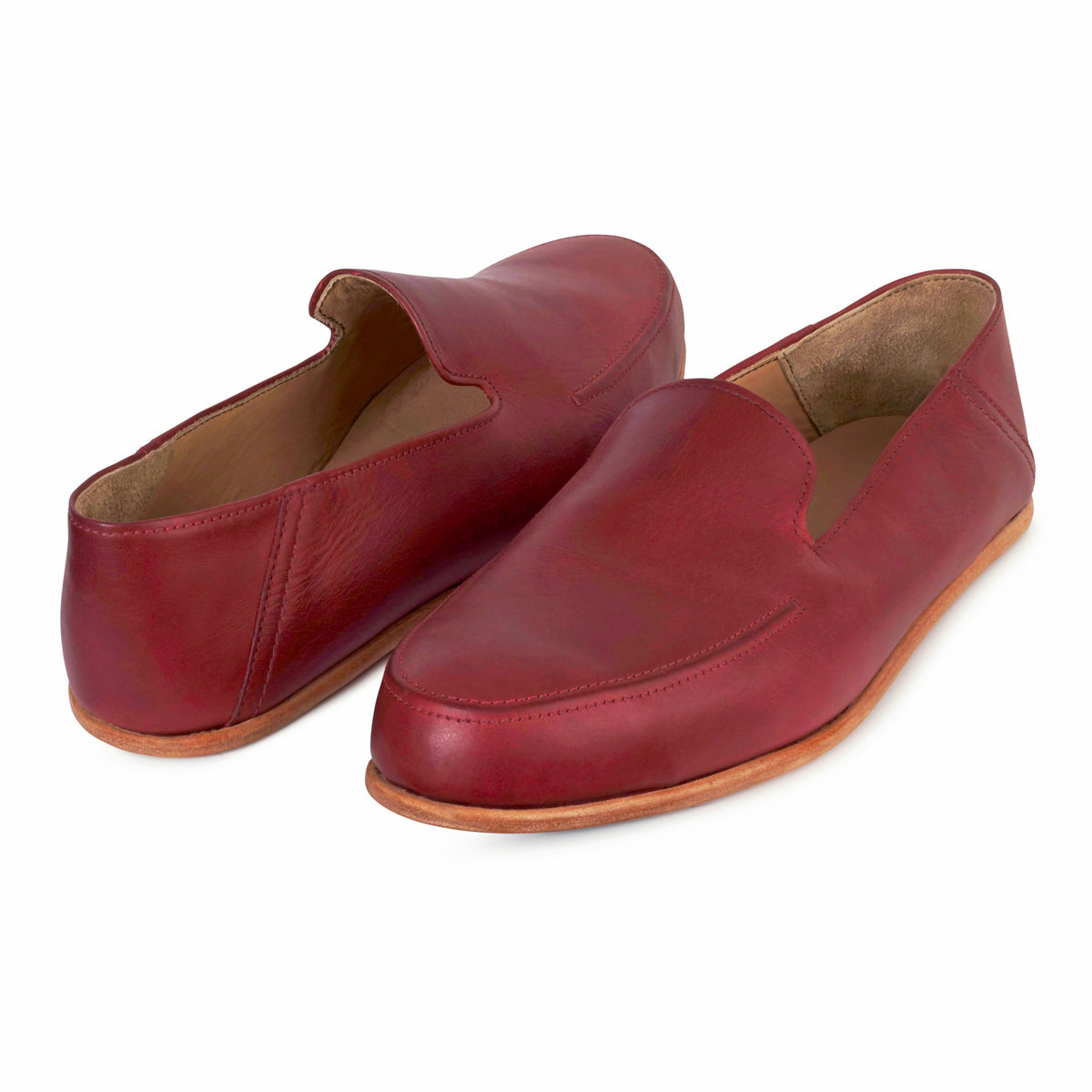 Pair of men's 4E-wide red leather zero-drop loafers, shown from the front at an angle, each pair made to order – The Tomás