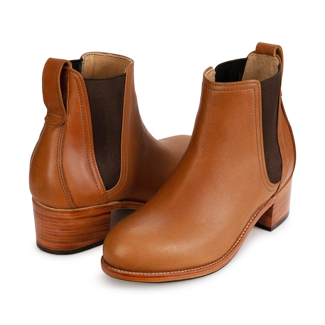 Women's narrow A-width light brown leather heeled Chelsea boots, shown from the front at an angle. Custom sizing on request