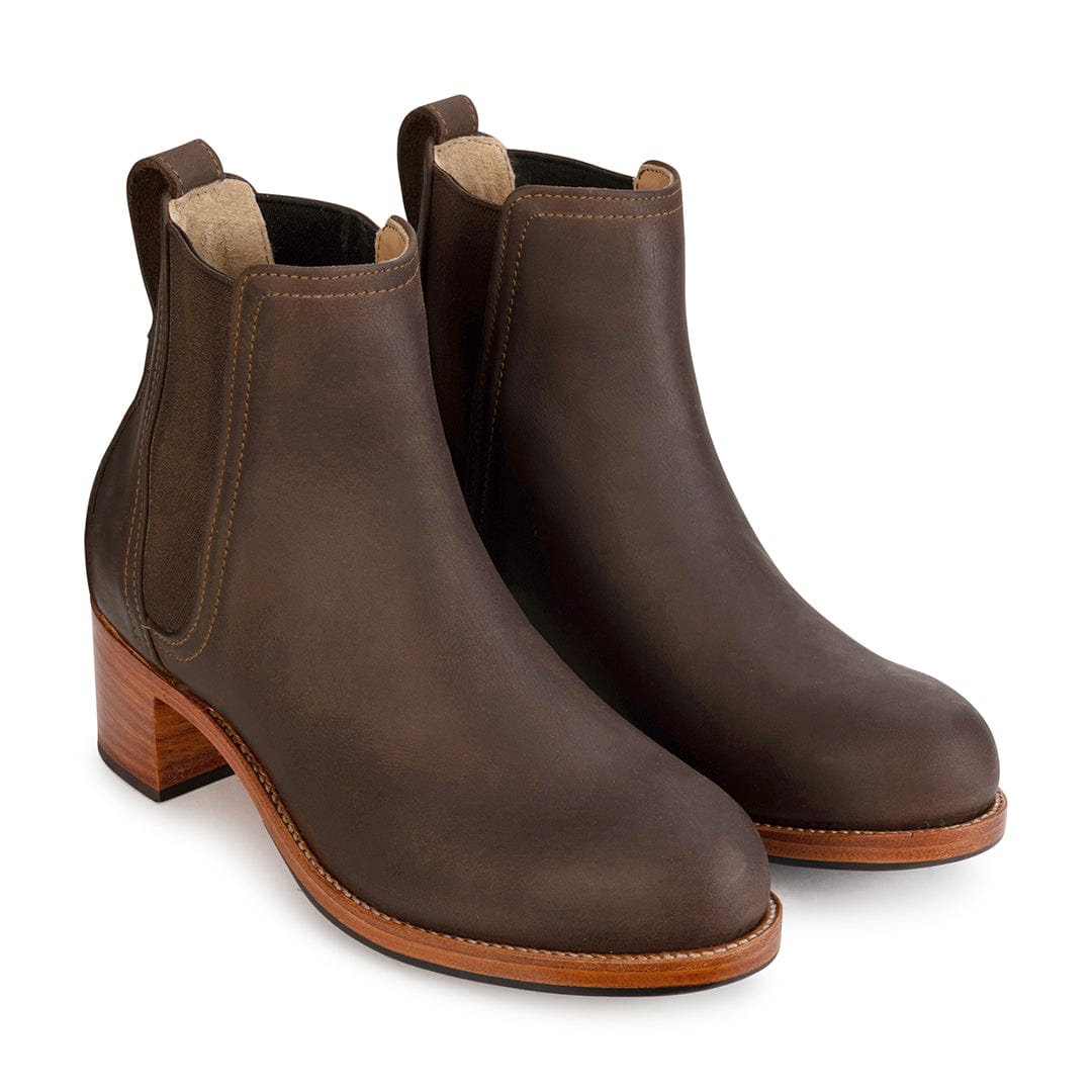 Women's 2E-wide dark brown leather heeled Chelsea boots, shown from the front at an angle. For feet that are hard to fit