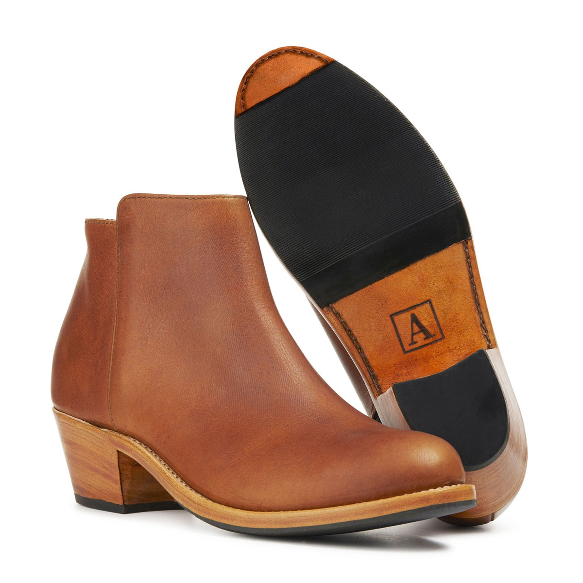 Adelante women's brown leather ankle boot with a tapered heel and sleek pointed toe silhouette