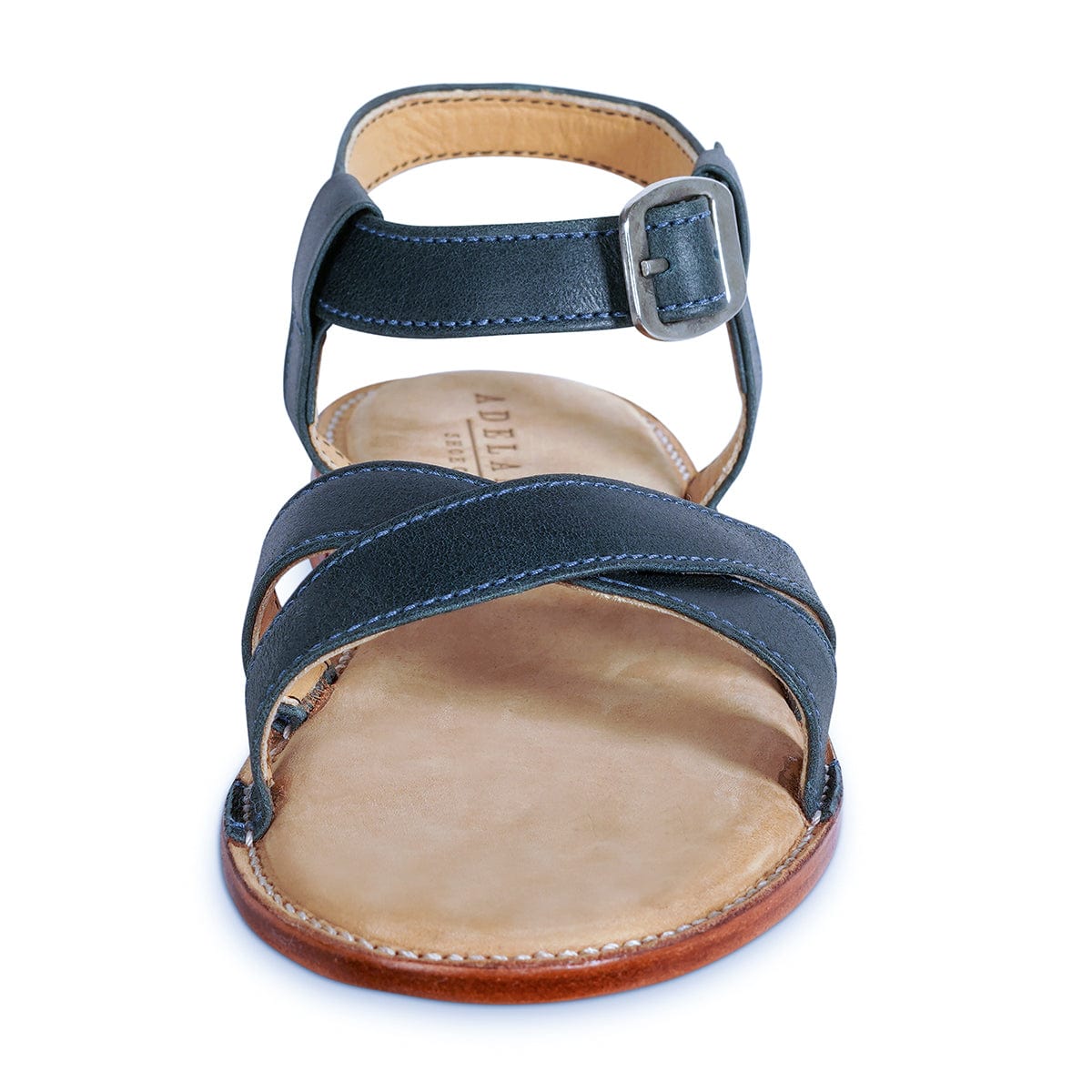Adelante handcrafted navy leather womens sandal with crossed straps, adjustable ankle buckle, cushioned footbed, and wide width options