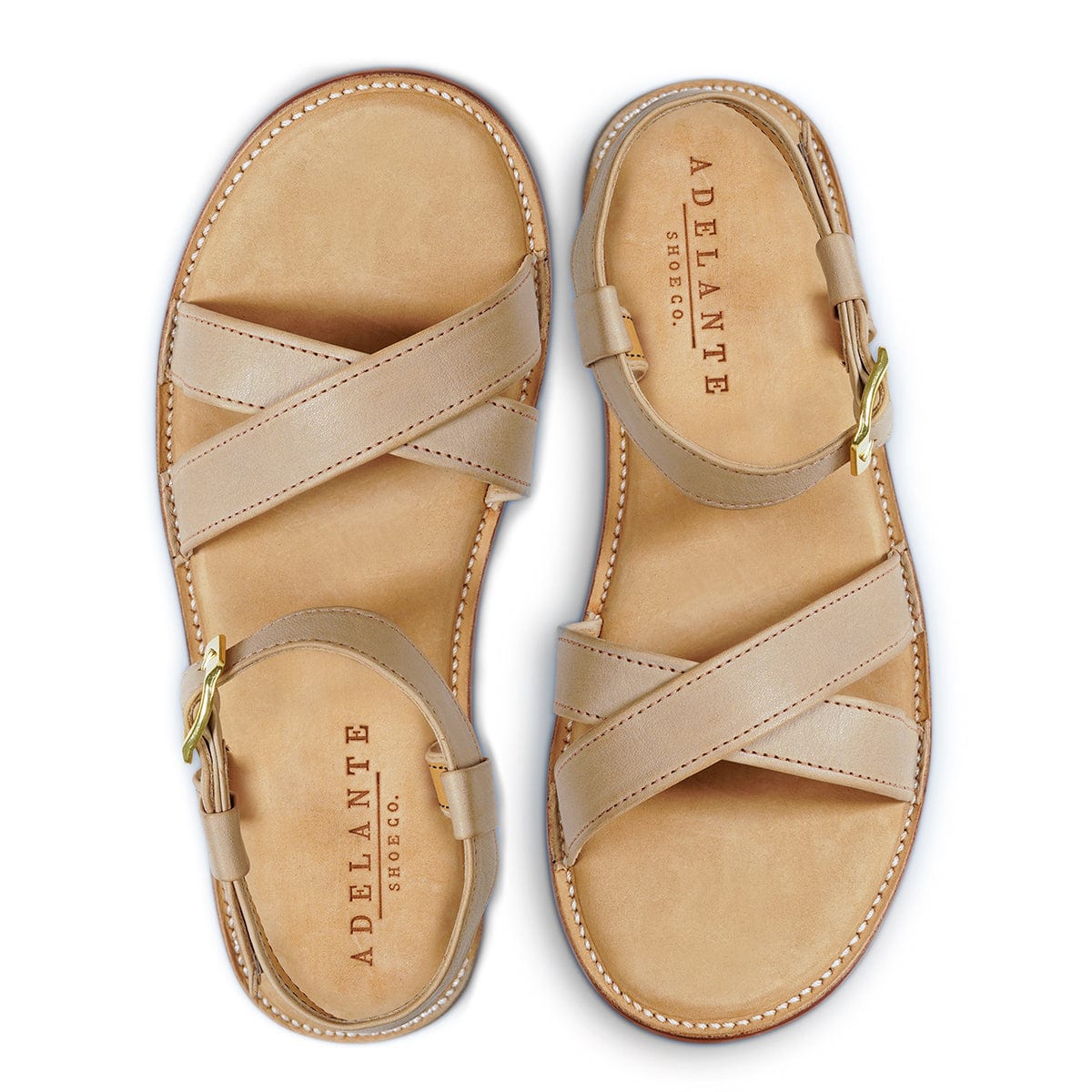 Adelante women's tan leather sandals with crisscross straps, adjustable ankle buckles, and cushioned footbeds