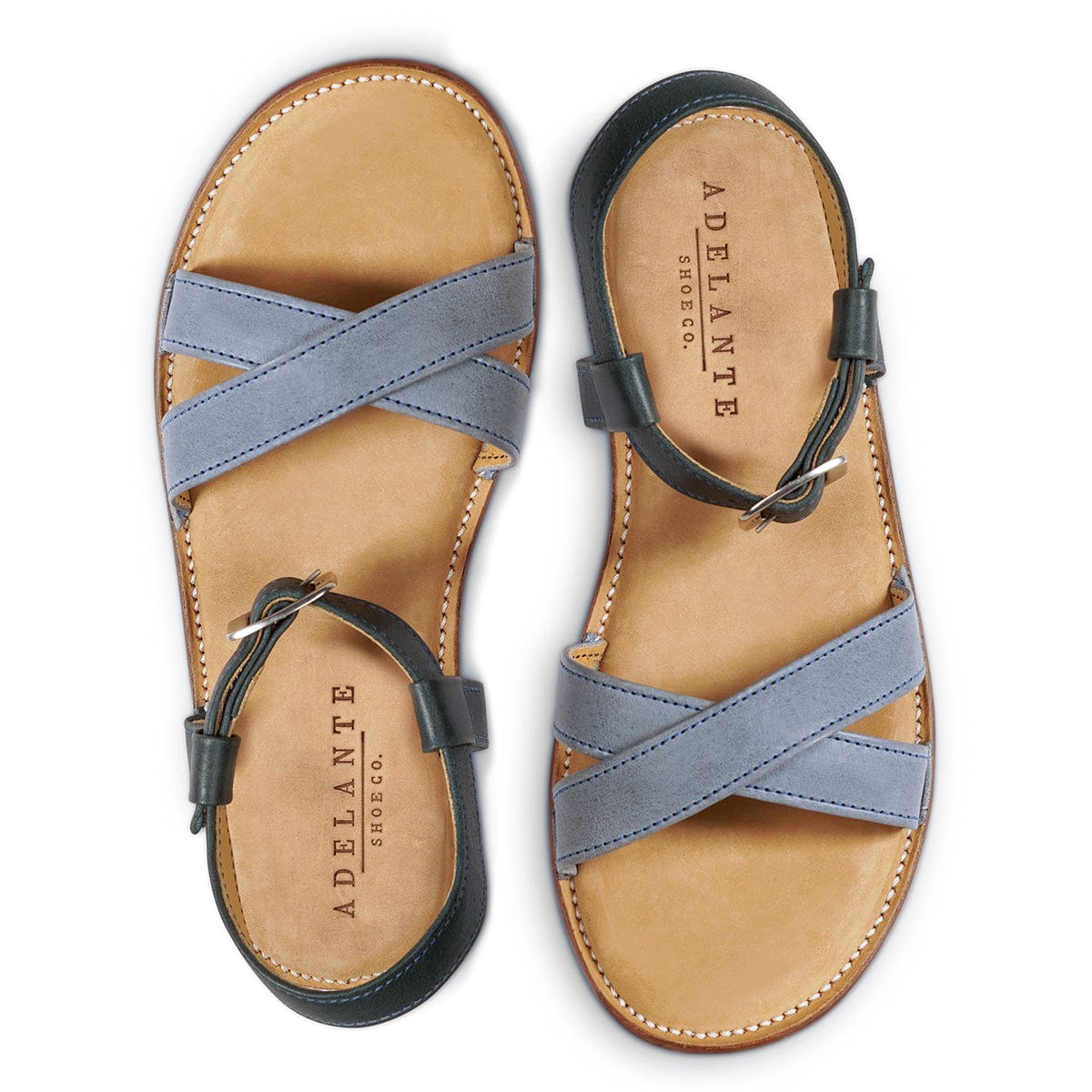 Blue gray leather women’s sandals with crisscross straps, adjustable ankle buckles, and cushioned footbeds, handcrafted by Adelante Made-To-Order