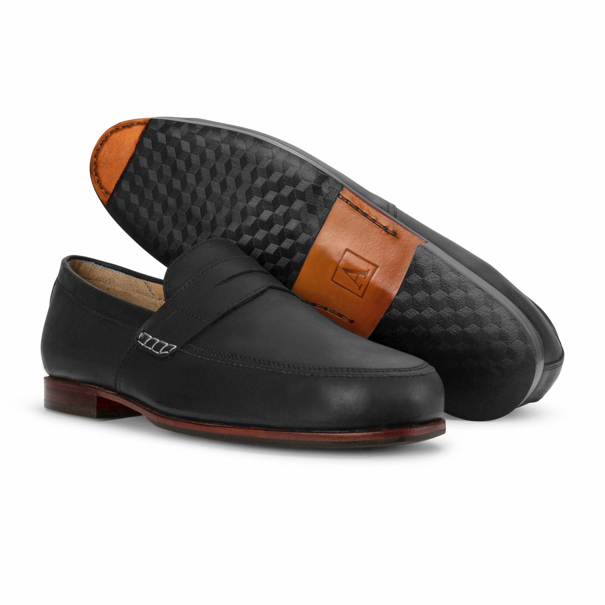 Black men's leather loafer with penny strap and textured sole, handcrafted by Adelante artisans in Guatemala