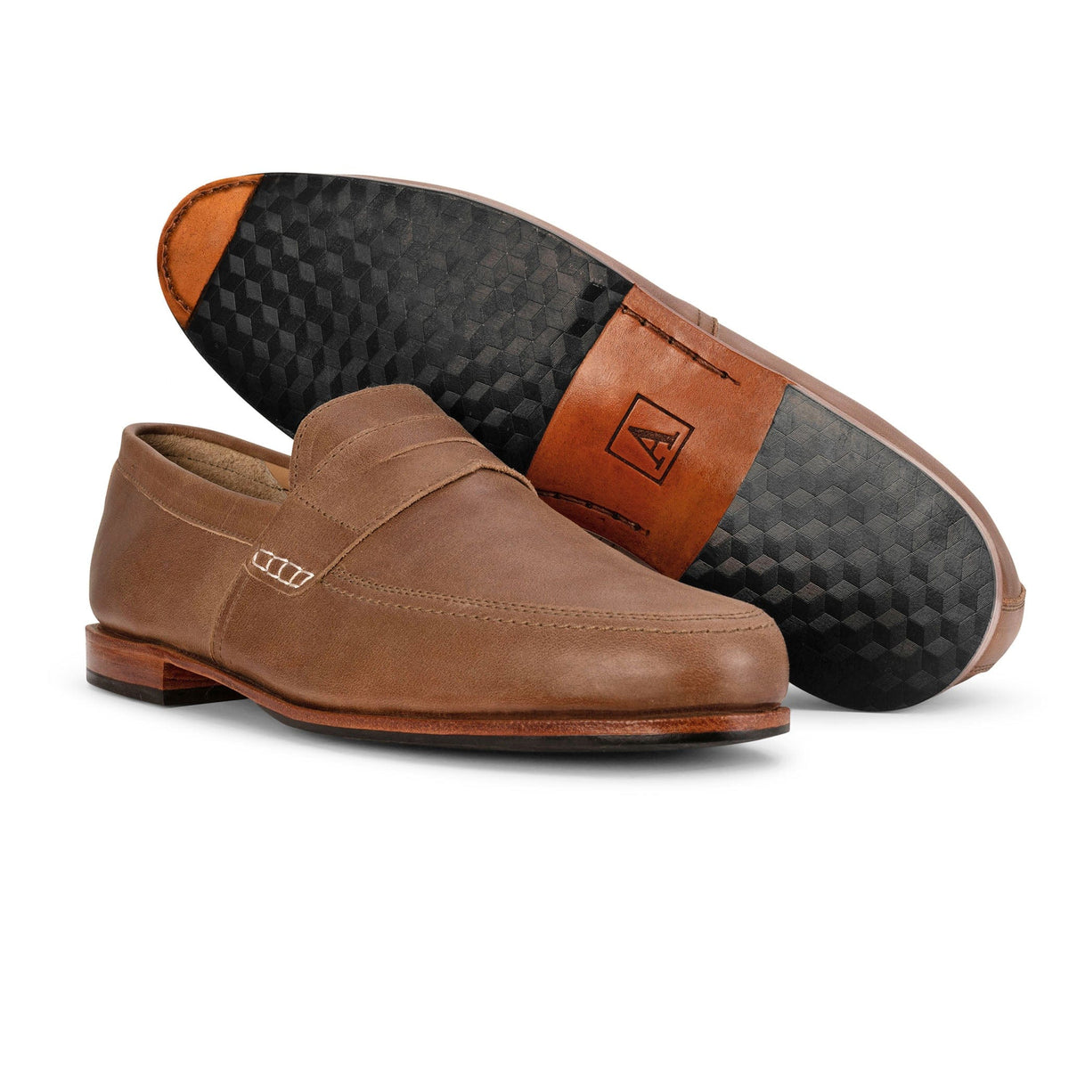 Adelante brown leather mens loafers with a sleek slip on design and patterned black soles