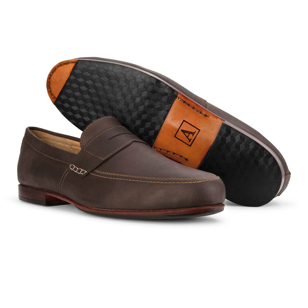Handcrafted brown leather men's dress loafers with stitched details and patterned black soles available in wide widths