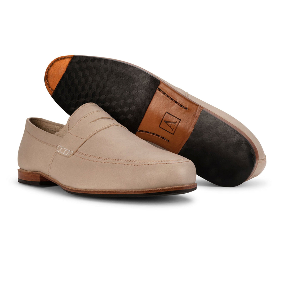 Adelante handcrafted mens beige leather dress loafers with one shoe showing its patterned leather sole