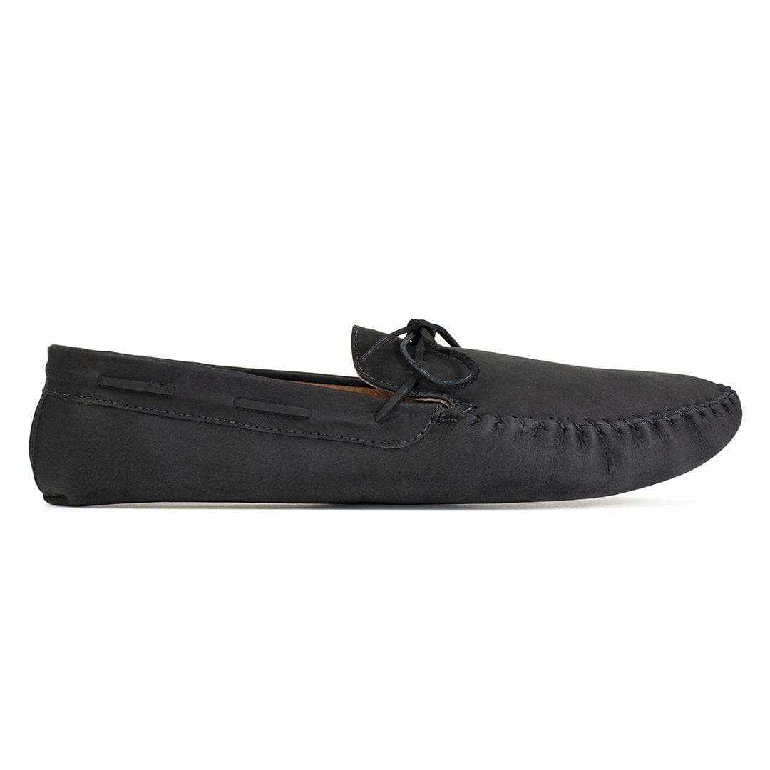 Men's extra-wide black leather moccasin, seen from the side, with split sizing for two different-sized feet