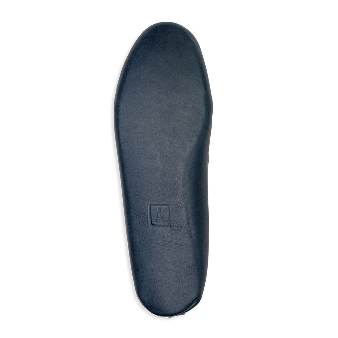 Men's 2E-wide blue leather moccasin, showing the leather sole, made to your exact length and width