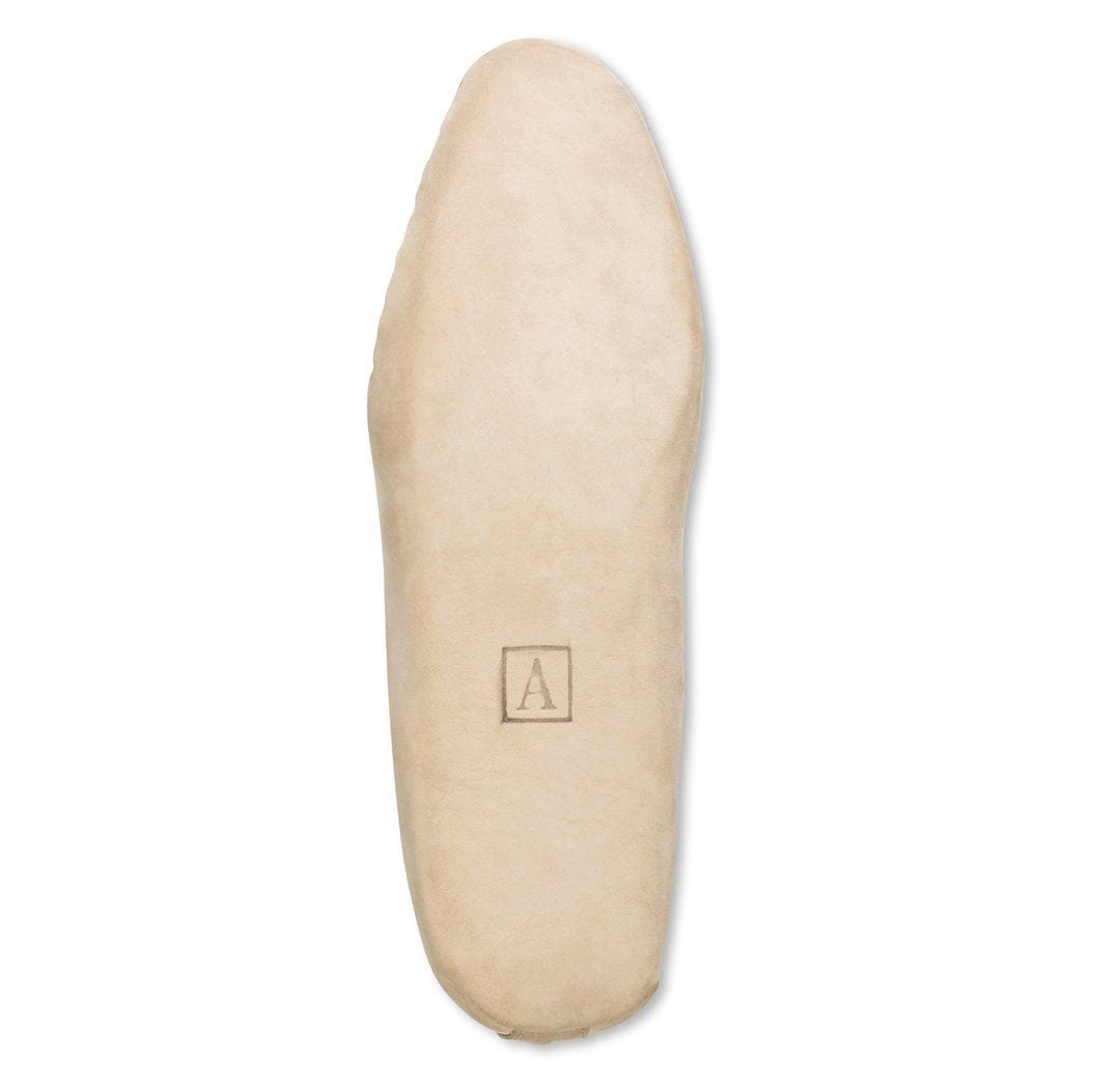 Men's 3E-wide cream leather moccasin, with the sole turned up, handcrafted to fit size 6.5