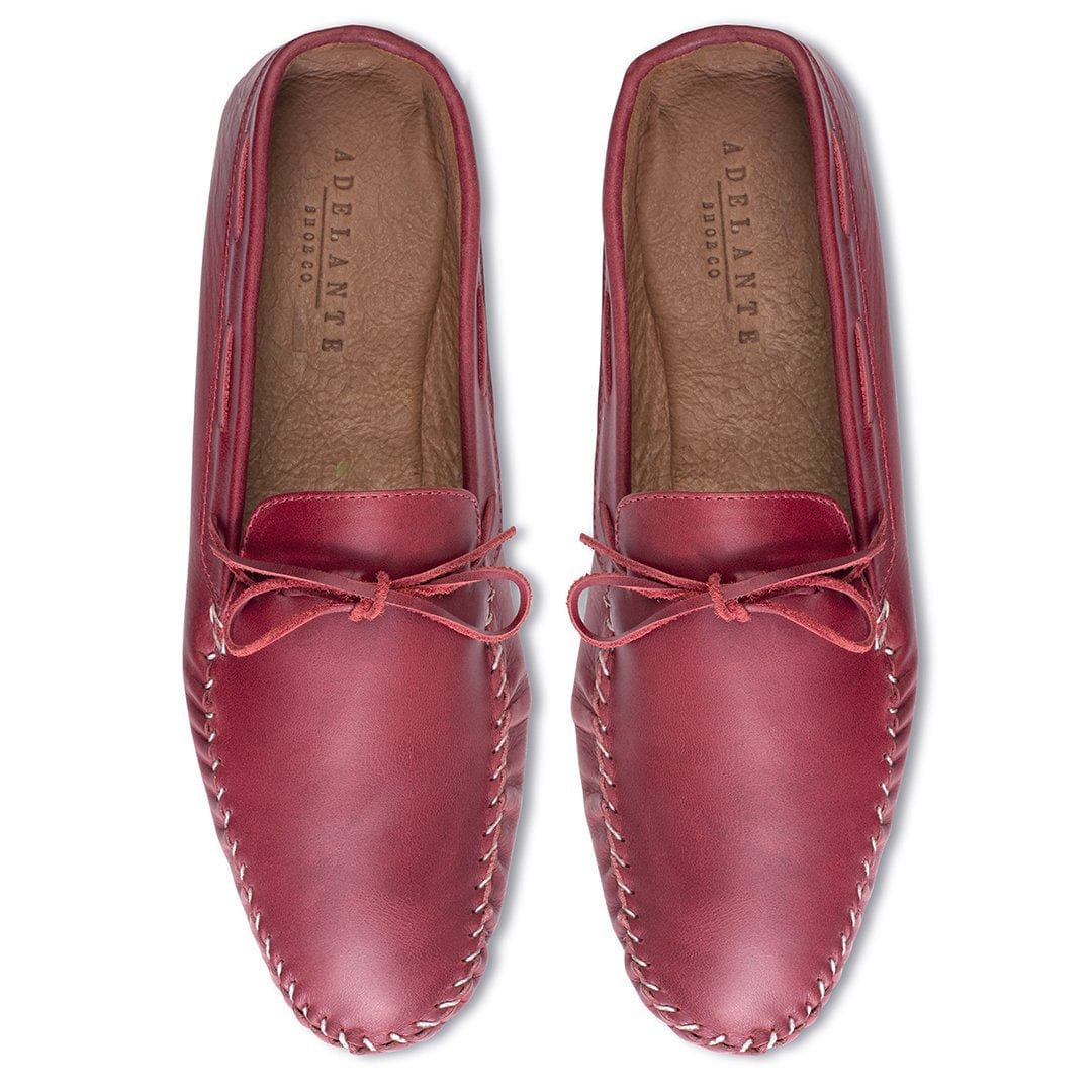 Top-down view of a pair of men's extra-wide red leather moccasins, a size 4 is no problem