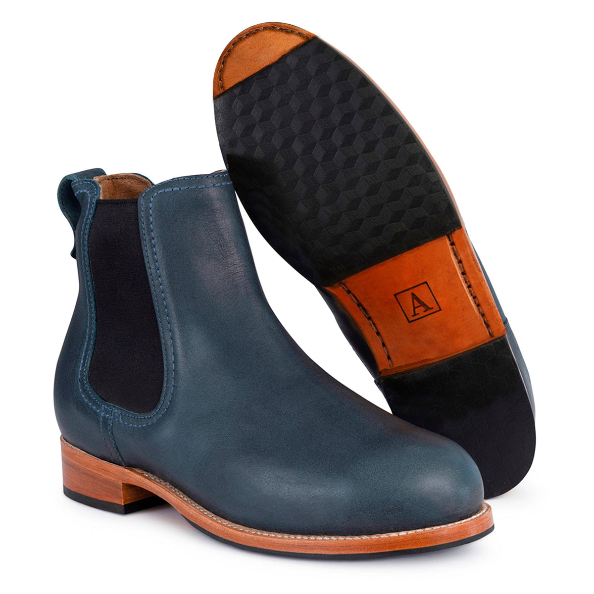 Navy blue women's Chelsea boots with contrast stitching elastic side panels pull tabs and textured soles available in size 4 and wide widths