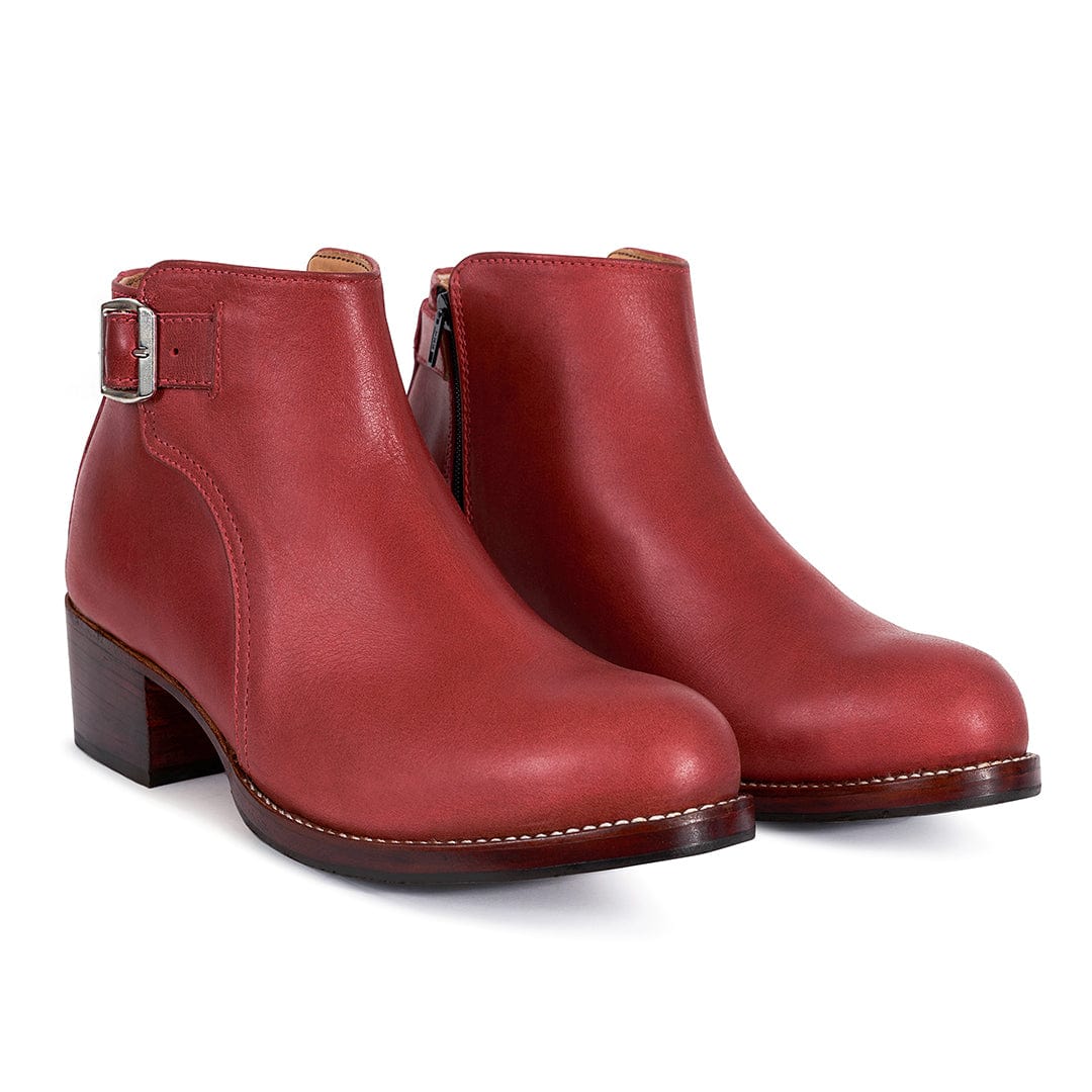 Red women's buckle booties with adjustable side straps and sturdy block heels