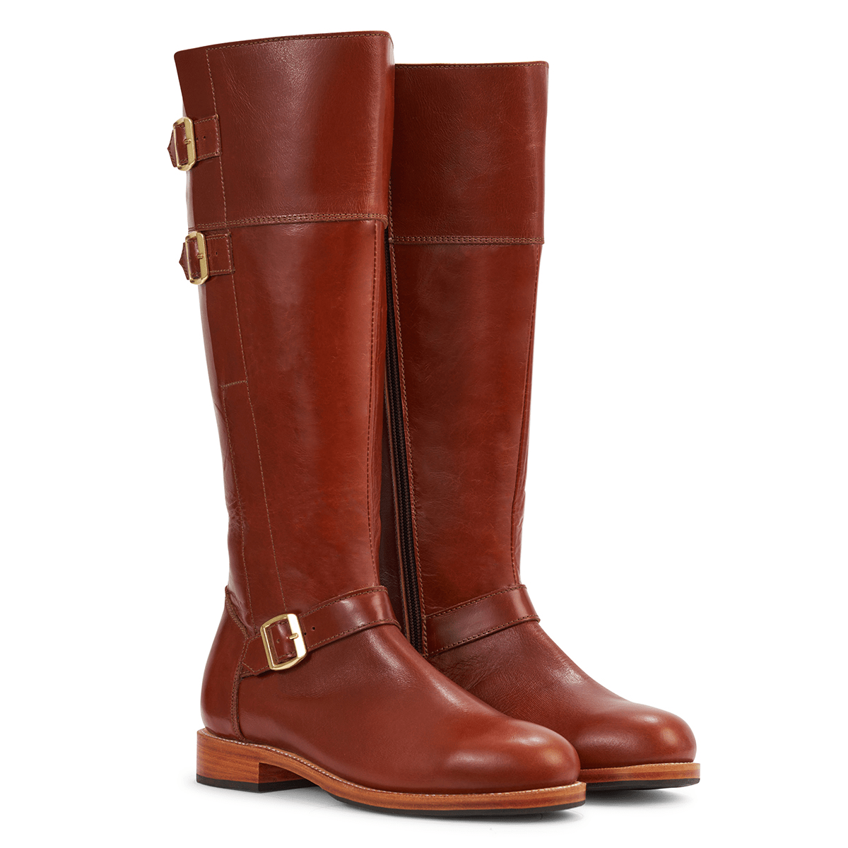 Brown leather knee-high riding boots with brass buckles and wraparound straps, made to order by Adelante for wide calf fit