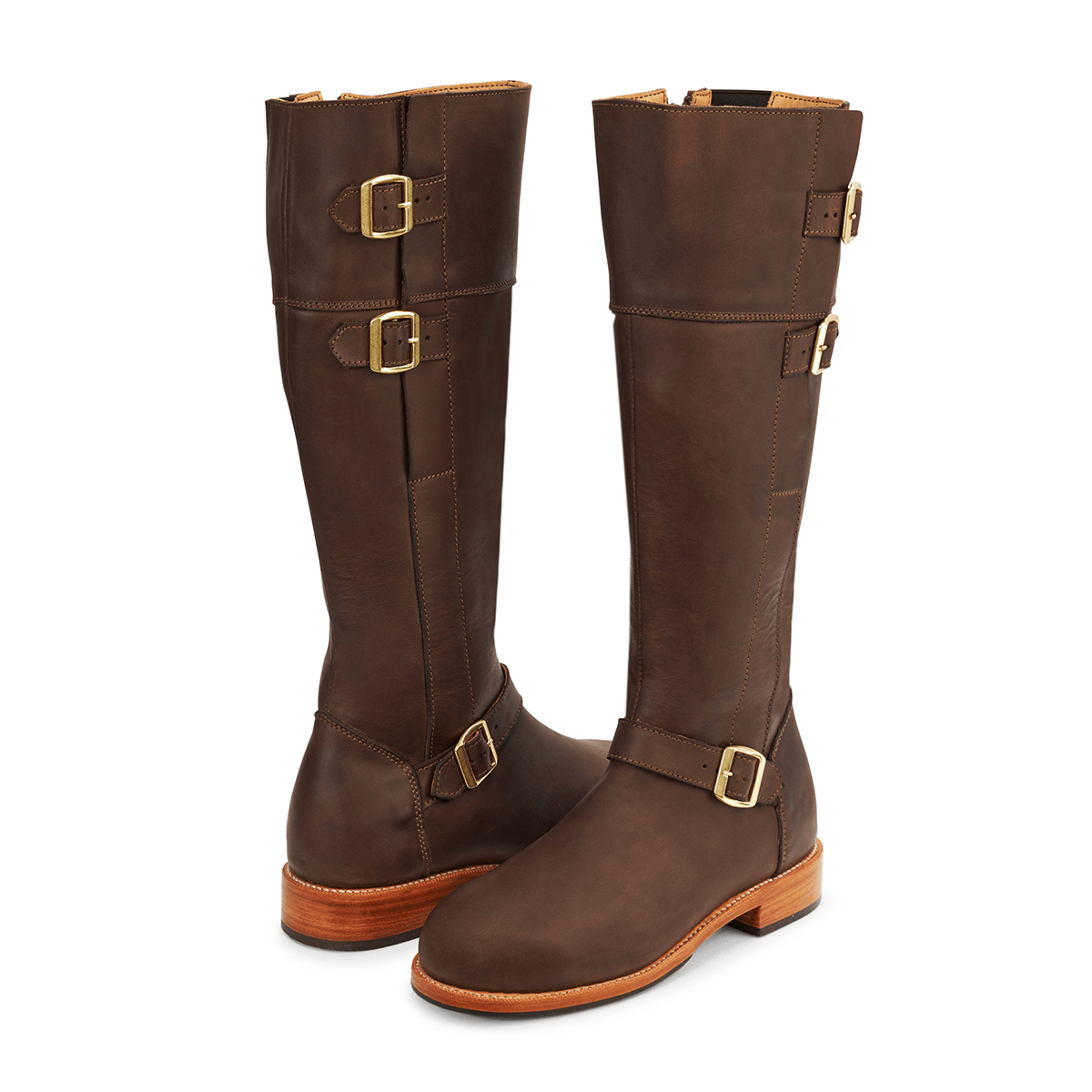 Brown leather knee high riding boots with brass buckle details and made to order wide calf sizing by Adelante
