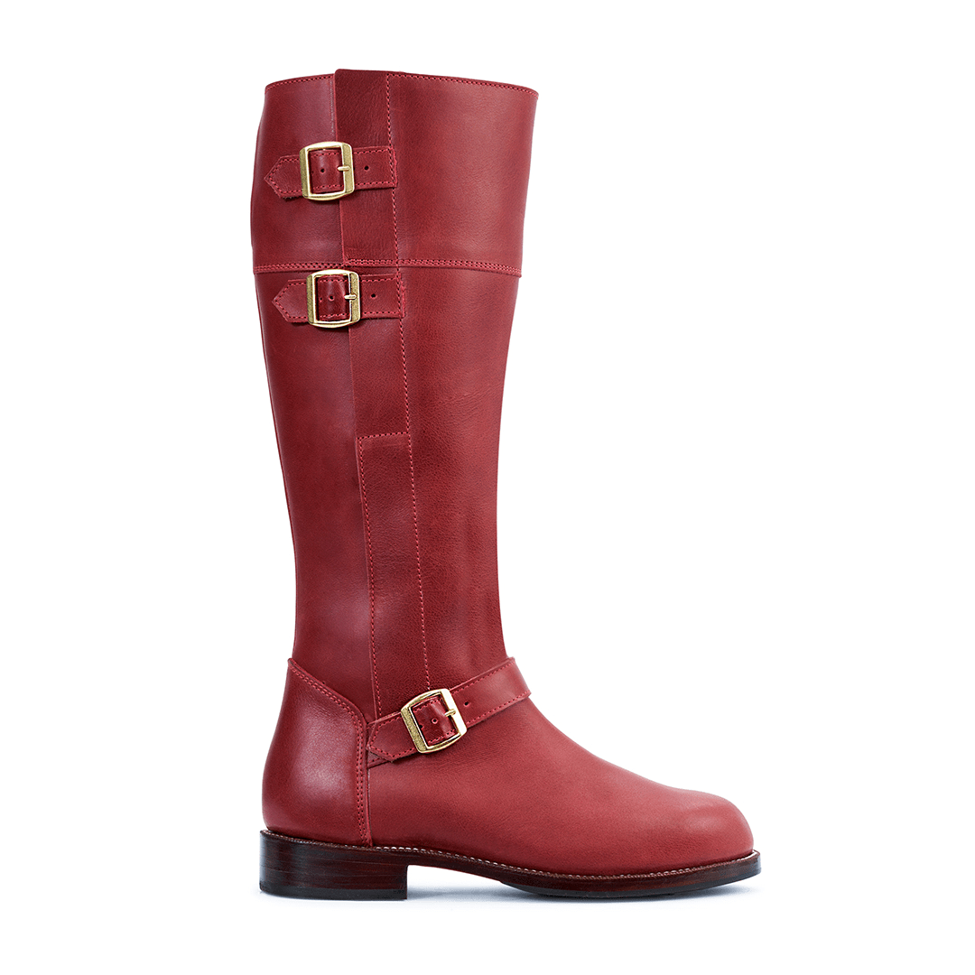 Burgundy leather knee high riding boot with brass buckles and wraparound straps, made to order with wide calf sizing by Adelante