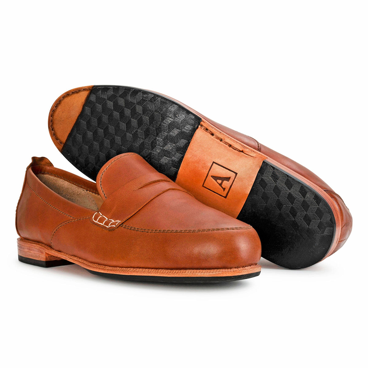 Women's wide light brown leather dress loafers, shown with the sole turned up – The Sabina
