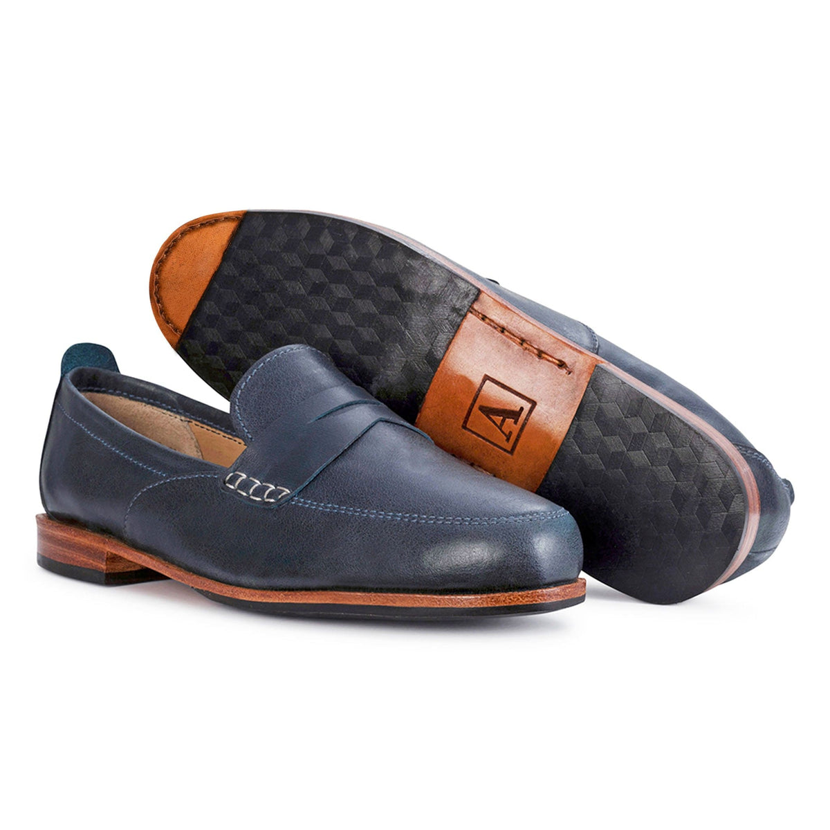 Women's EE wide blue leather dress loafers, shown with the sole turned up – The Sabina