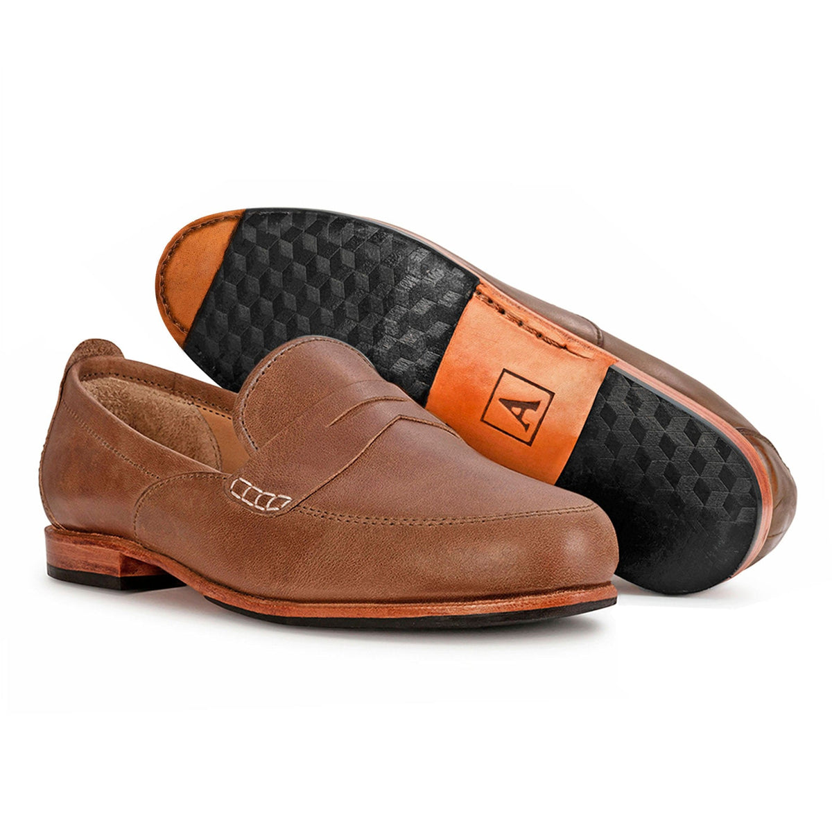 Women's 3E-wide tan leather dress loafers, shown with the sole turned up, a size 9.5 is no problem – The Sabina