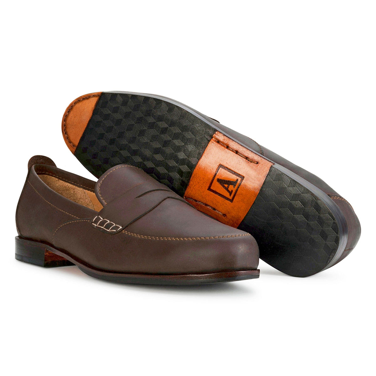Women's wide dark brown leather dress loafers, shown with the sole turned up – The Sabina