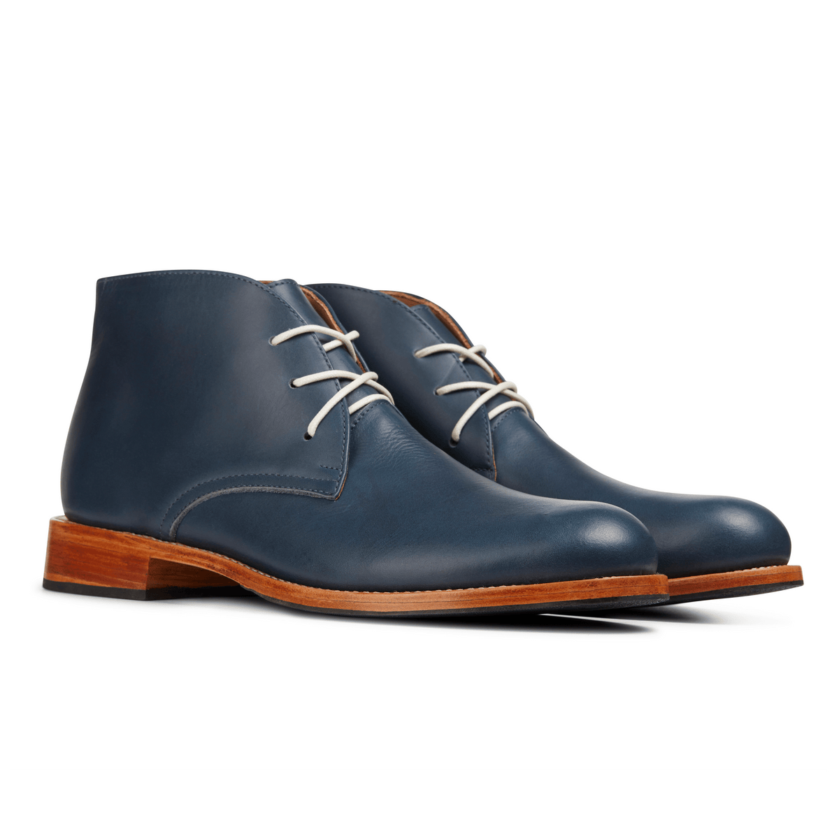 Men's EEEEE extra-wide blue leather chukka boots, shown from the front at an angle. Crafted for wide and narrow feet – The Santiago