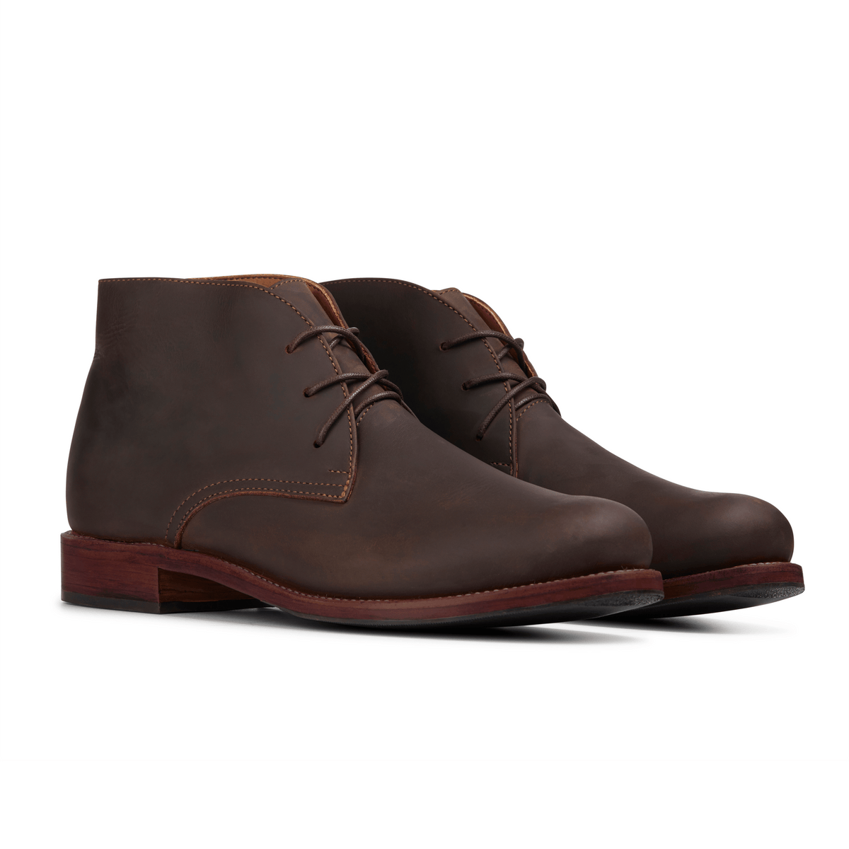 Pair of men's EEE wide dark brown leather chukka boots, shown from the front at an angle, made to your exact length and width