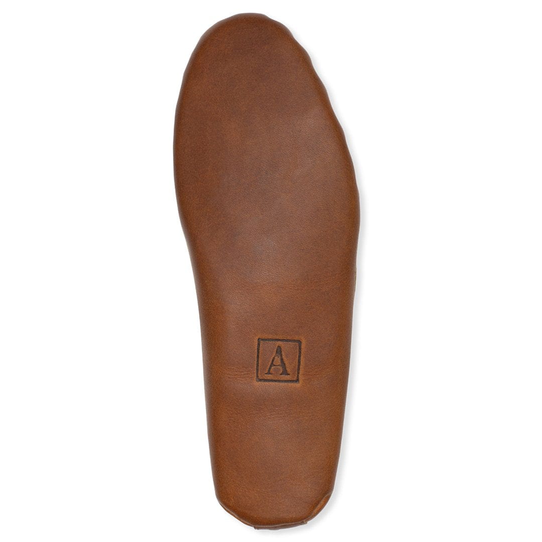 Brown leather moccasin footbed with embossed Adelante logo